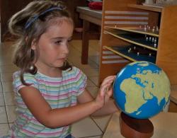 Emma Hawley feels land masses on a globeat the St. Croix Montessori School. Emma Hawley feels land masses on a globeat the St. Croix Montessori School.